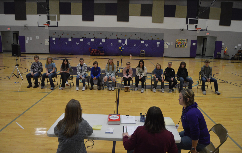 Twelve young spellers line up and get ready for the Nemaha Central Spelling Bee.