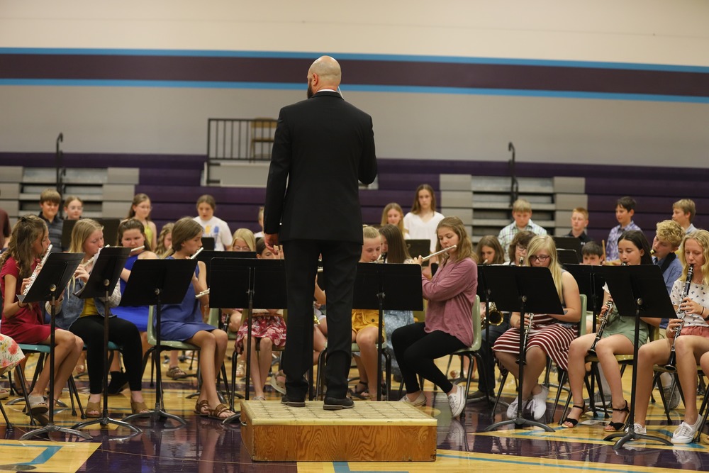 Mr. Todd Krause (middle) conducting the 6th grade NCEMS band